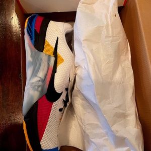 Nike Metcon 7 mens size 11.5. Color white with blue, yellow and pink trim